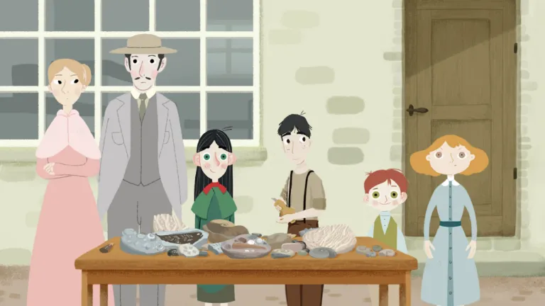 Familie bij tafel met gevonden fossielen