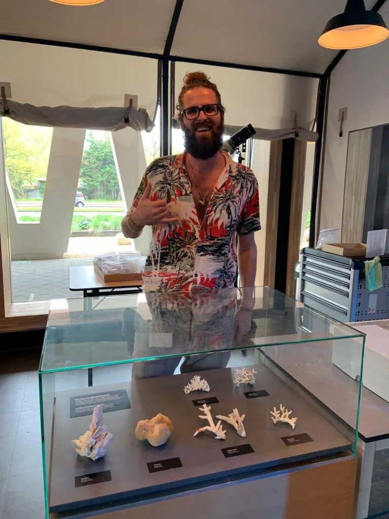 Mike Hynes working in Naturalis and showing a coral collection